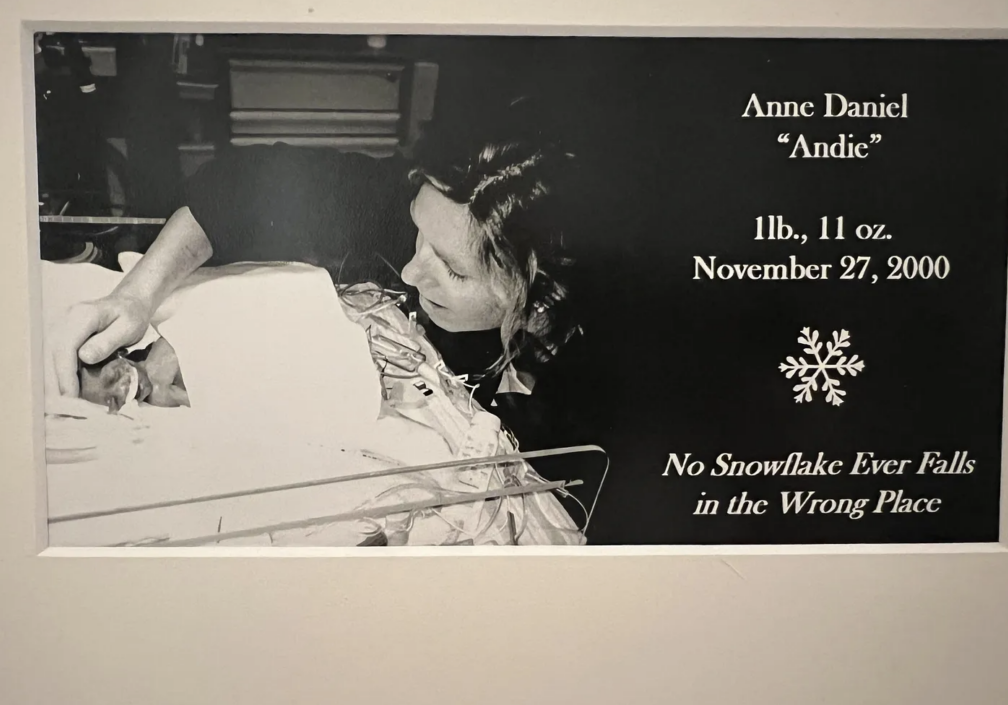 mother holding premature baby in NICU reflecting on milestones uncertainty and grace